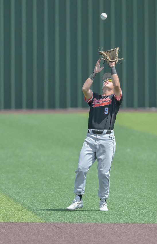 Cade Pulido backs up to cover a fly ball to short right field in the regional final against Mansfield Legacy.